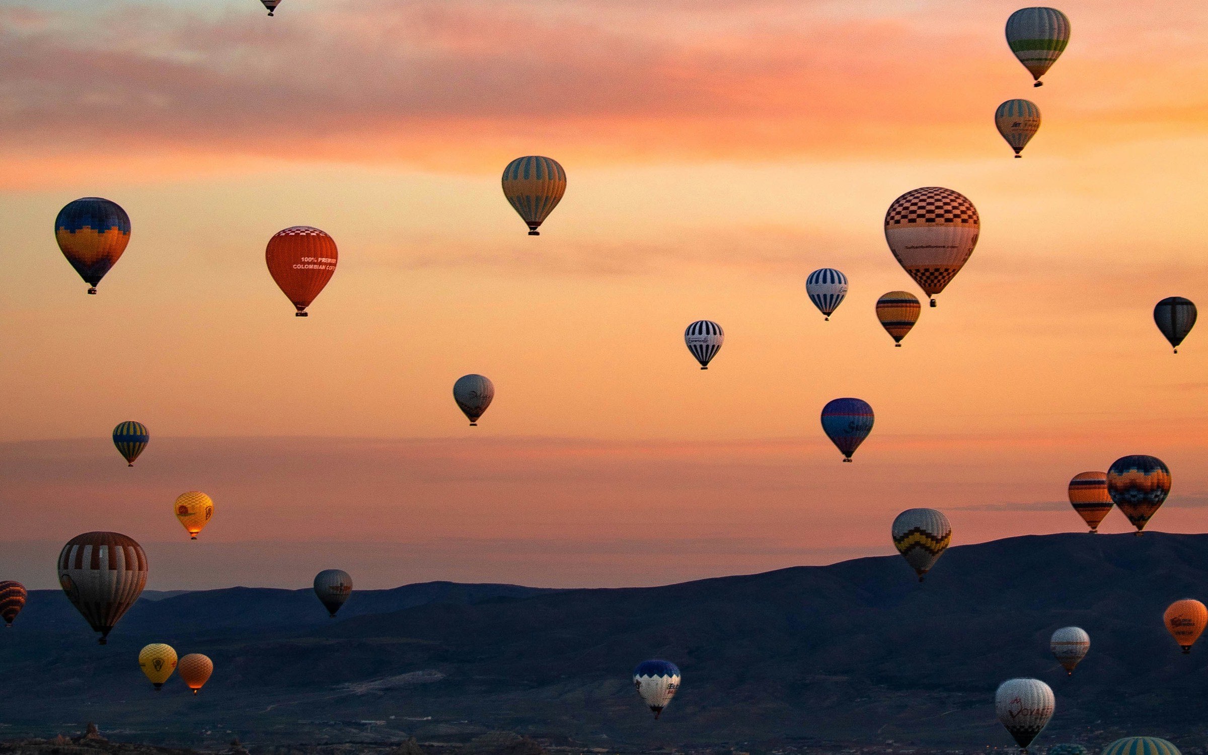 Hot-air balloons over Cappadocia at sunrise